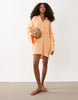 double cloth mini shirt dress with wide cuffs and oversized pockets in orange spritz