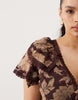 Curve full hem ruffle maxi dress with lace trim detailing and open back in brown floral