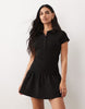 hybrid rib interlock peplum hem mini polo dress in black