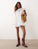 Noughts & Kisses crochet insert flutter sleeve dropped hem mini dress in white