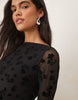flocked floral mini dress with flute sleeve in black