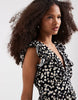 Vero Moda Easy Joy ruffle shoulder plunge front midi dress in black ditsy daisy print