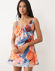bias cut scoop neck low back satin mini dress in bright abstract print