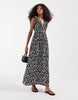 Vero Moda Easy Joy ruffle shoulder plunge front midi dress in black ditsy daisy print