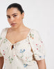 Vero Moda Curve puff sleeve tie front detail maxi dress in cream floral print