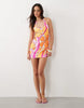 Kulani Kinis sunrise swirl halterneck mini dress in pink and orange