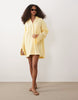 double cloth mini shirt dress with wide cuffs and oversized pockets in lemon