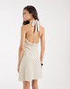 Vero Moda Tall halter neck polka dot mini dress in cream and black