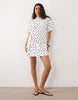 wrapped waist mini dress with lace hem in mono polka dot