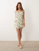 scoop neck mini dress with shaped hem and all over beaded embellishment in Light Green
