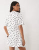 wrapped waist mini dress with lace hem in mono polka dot