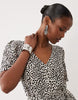 VILA tie waist polka dot mini dress in cream and black