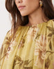 full volume cape sleeve maxi dress with godets in green floral print