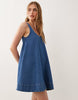 denim scoop neck trapeze dress with pockets in mid blue