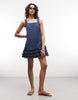 Reclaimed Vintage denim cami mini dress with ruffle details in mid blue