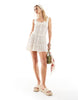 Esmee Exclusive mini lace beach dress with ruffle skirt in cream