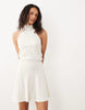 textured halter neck mini dress in ecru