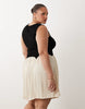 Curve color block crinkle mini dress in black & cream