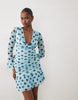 Kaiia Exclusive mesh overlay long sleeve cowl neck asymmetric hem mini dress in blue and black polka dot