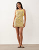pinny mini dress with pockets and ruffles in yellow ditsy print