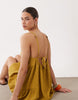 textured halter trapeze mini dress in ocre