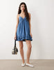 denim v neck mini dress with frill detail in mid blue