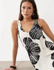 sleeveless v-neck trapeze maxi dress in black and cream leaf print