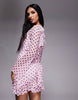 Kaiia exclusive slinky long sleeve ruffle hem open back mini dress in pink and black polka dots