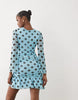 Kaiia Exclusive mesh overlay long sleeve cowl neck asymmetric hem mini dress in blue and black polka dot