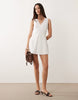 Good American broderie anglaise sleeveless v neck mini dress in white