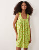 ruched neck mini sundress in green floral print performance fabric