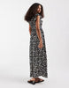 Vero Moda Easy Joy ruffle shoulder plunge front midi dress in black ditsy daisy print