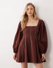 square neck twill mini dress with puff sleeves and contrast stitching in warm chocolate