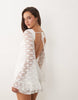 The Frolic exclusive boat neck open back frill sleeve & hem mini dress in white