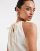 halter neck trapeze shaped waist mini dress in cream