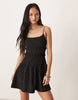 crinkle mini sundress with shirred dropped waist in black