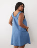 Curve denim ruffle detail mini dress with pockets in mid blue