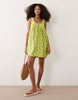 ruched neck mini sundress in green floral print performance fabric