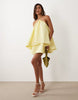 halter neck trapeze mini dress in soft yellow