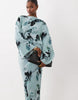 long sleeve tucked waist bias maxi dress in blue blurred floral print