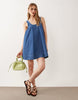 denim scoop neck trapeze dress with pockets in mid blue