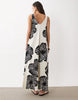 sleeveless v-neck trapeze maxi dress in black and cream leaf print