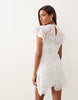 crochet flutter sleeve mini dress in ivory scuba-style fabric