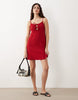textured strappy mini dress with tie detail front in red
