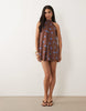 bow detail mini dress in brown and blue spot