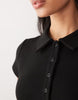 hybrid rib interlock peplum hem mini polo dress in black