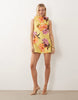 high slash neck mini dress with trim back detail in floral print scuba-style fabric