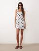 square neck bodycon mini sundress in blue and burgundy polka dots