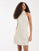 Vero Moda halter neck polka dot mini dress in cream and black