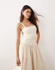 ARRANGE premium waisted dress with puffball hem in ecru